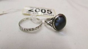 Two silver rings, sizes I and P.