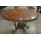 An oval mahogany inlaid dining table (top needs re-polishing).