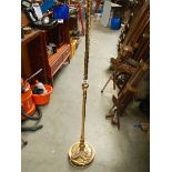 A brass standard lamp.