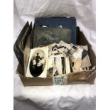 A box of old sepia photographs including albums & postcards