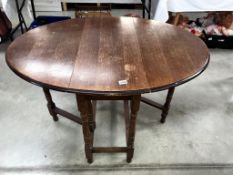 A 1930's oak gate leg table, 89 x 120 cm open, 73 cm high.