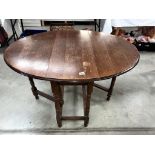 A 1930's oak gate leg table, 89 x 120 cm open, 73 cm high.