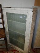 A glazed door cabinet.