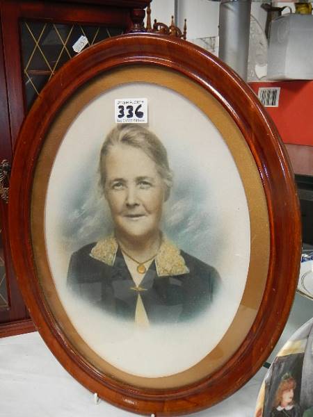 A 1920's portrait of an old lady in oval frame.