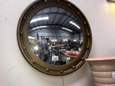 A vintage gilt framed round concave mirror (diameter 51cm)