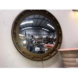 A vintage gilt framed round concave mirror (diameter 51cm)