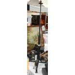 A wrought iron standard lamp base.