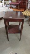 A mahogany occasional table.