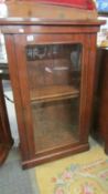 A mahogany glazed cabinet.