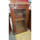 A mahogany glazed cabinet.