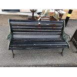 An early 20th century cast iron and wooden garden bench,