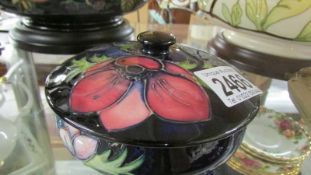 A Moorcroft lidded powder bowl.