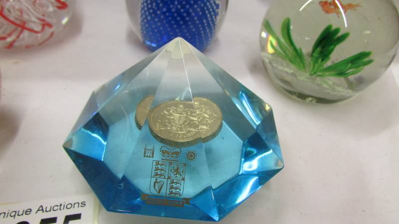 Five glass paperweights and a perspex Royal Mint paperweight inset with £1 coin. - Image 7 of 7