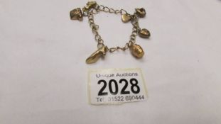 A 9ct gold charm bracelet, 11.3 grams.