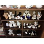 A large collection of cat figures