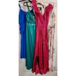 Four evening gowns in varying sizes and designs
