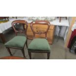 A pair of Victorian mahogany dining chairs.