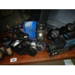 A mixed lot of camera's and lenses.