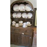 An oak arched top dresser with carved linenfold doors.
