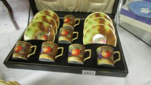 A cased hand painted Japanese coffee set, signed.