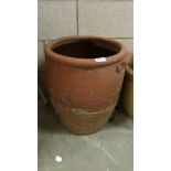 A large terracotta planter.