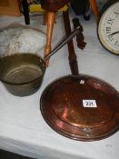 A Victorian copper warming pan and a brass saucepan.