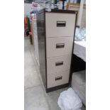A four drawer filing cabinet.