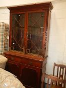 A mahogany astragal glazed book case.