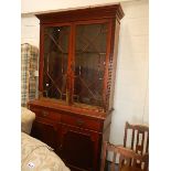 A mahogany astragal glazed book case.