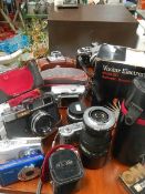 A mixed lot of camera's and lenses.