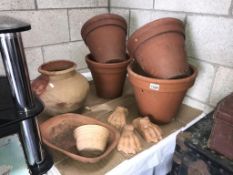 A selection of terracotta plant pots including lions feet some a/f