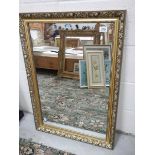 A gilt framed mirror. 61 x 87 cm.