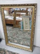 A gilt framed mirror. 61 x 87 cm.