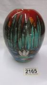 An Anita Harris art pottery vase, pond lilies.