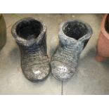 A pair of boot shaped planters.