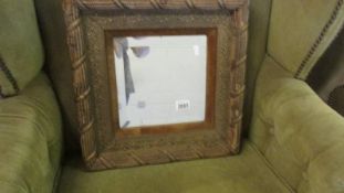 An unusual square framed bevel edged mirror.