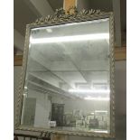 A framed bevel edged mirror.