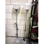 A pair of silver finished uplighter floor standing lamps