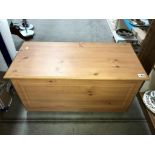 A pine effect blanket/storage box