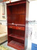 A mahogany glazed book case.