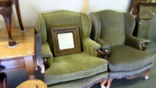 A pair of mahogany framed cabriole leg wing armchairs.