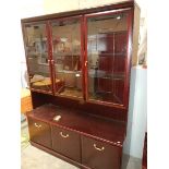 A mahogany effect wall unit.