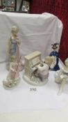 Three Lladro figures including girl at piano,