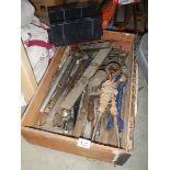 A box of old tools including child size last and small vice.