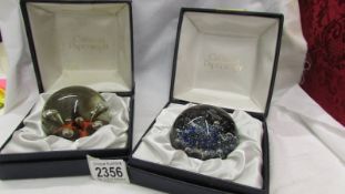 Two boxed Caithness paperweights.