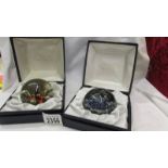 Two boxed Caithness paperweights.