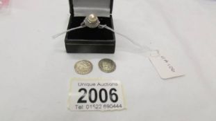 A silver ring size N half and two silver threepenny bits.