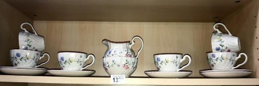 A pretty 14 piece tea set with milk jug & sugar bowl