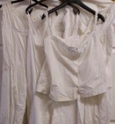 A collection of Victorian / Edwardian white clothing including camisole and bloomer one piece