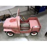 A vintage style Jeep Fire chief fire engine pedal car